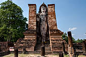 Thailand, Old Sukhothai - Wat Mahathat, 12-metre-tall statue of standing Buddha Phra Attharot enshrined in a roofless mandapa.  